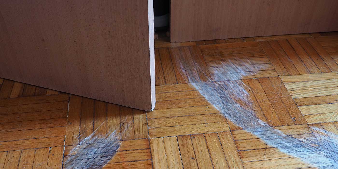 How can I make my wooden floor scratch-resistant?